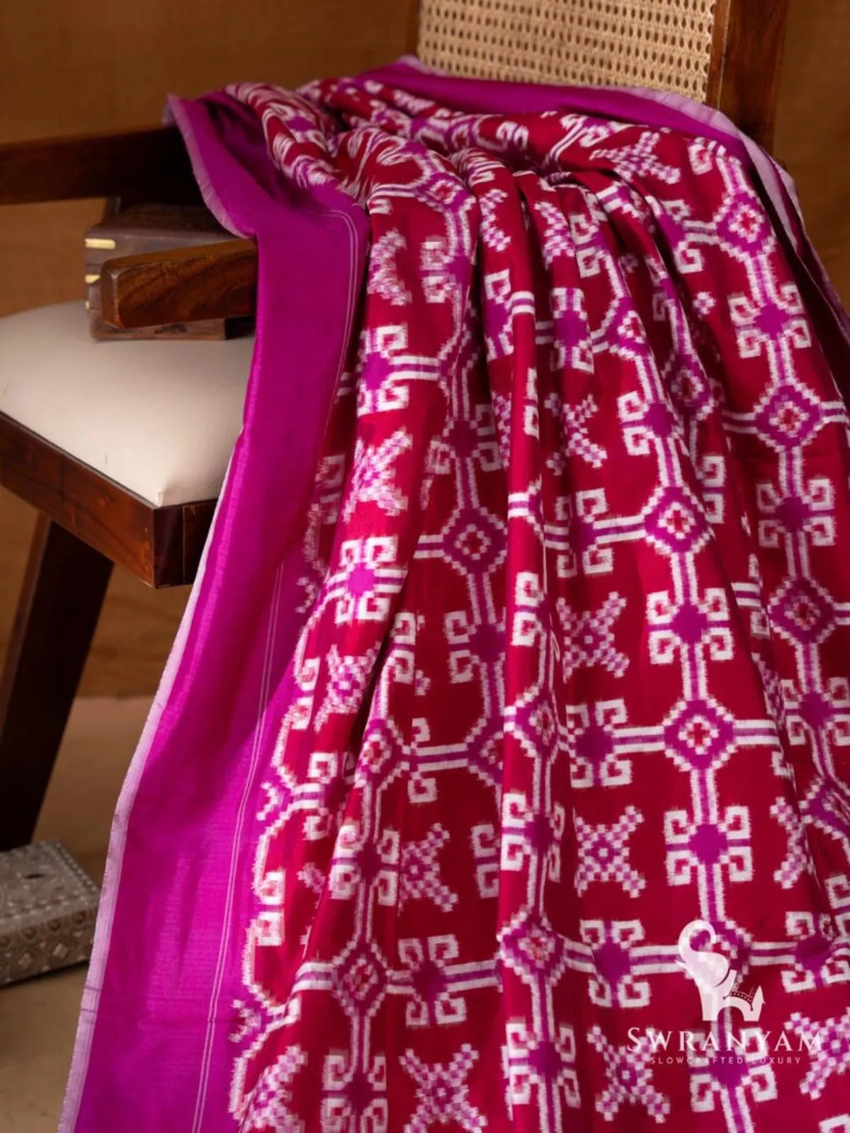 Crimson red Telia Rumal double ikat saree with magenta pallu showing red ikat motif panels, white pinstripes and tassels