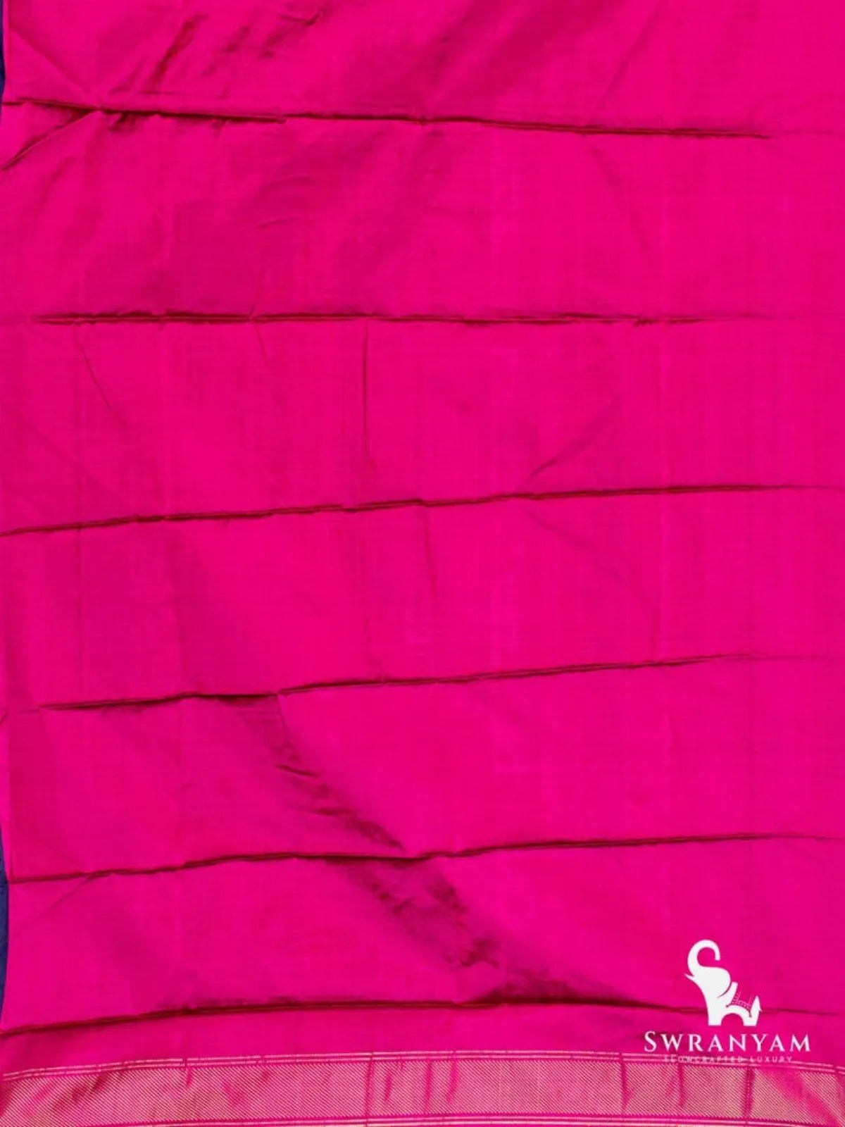 Plain pink silk fabric with zari border edge, part of the navy blue elephant motif Pochampally ikat saree
