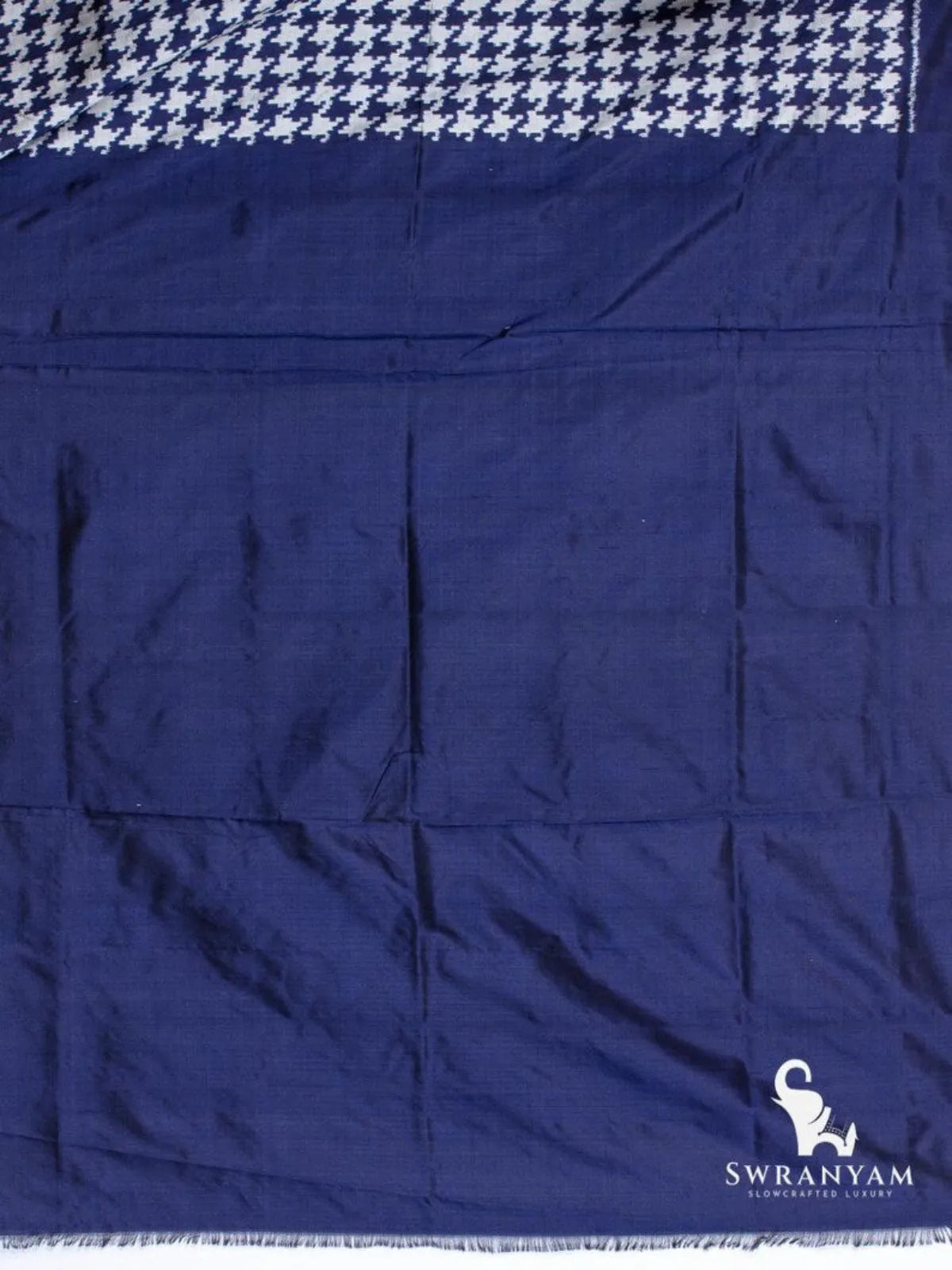 Plain indigo blue silk blouse piece at the end of the houndstooth Pochampally ikat silk saree