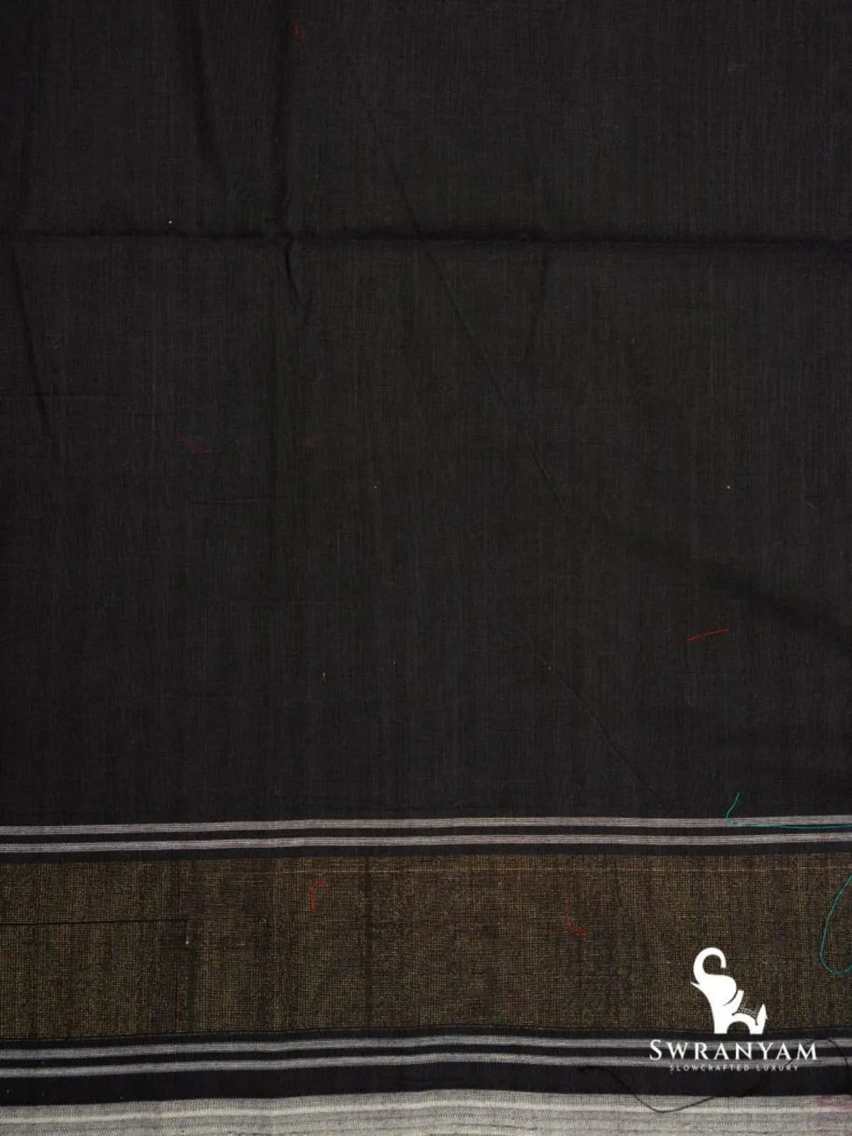 Plain black cotton end of emerald green ikat saree with olive band and white woven stripes