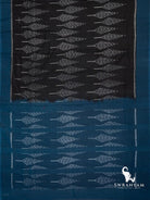 Flat lay of black Pochampally ikat cotton saree with leaf motif body and teal blue ikat pallu