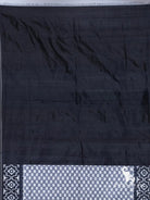 Plain black silk end of handloom ikkat saree with grey checker and geometric ikat border detail
