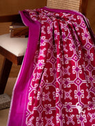 Crimson red Telia Rumal double ikat saree with magenta pallu showing red ikat motif panels, white pinstripes and tassels