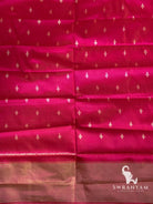 Pink silk blouse piece with small white ikat motifs and gold zari border, matching the pink Pochampally ikat saree
