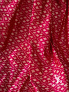 Close-up of white diamond and star ikat motifs on pink Pochampally silk saree fabric