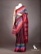 Maroon Pochampally ikat silk saree with multicolour diamond ikat border in orange, blue and green on mannequin