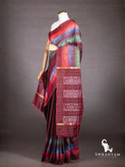 Maroon ikat silk saree with multicolour diamond ikat borders and maroon pallu with white ikat blocks and gold zari stripes