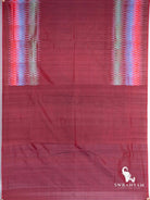 Maroon Pochampally ikat silk saree spread flat showing two multicolour diamond ikat borders and plain maroon end section
