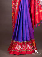 Royal purple ikat silk saree pleats with red ikat hem border of white elephants and yellow birds and red pallu