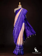 Royal purple and peach Pochampally tussar silk saree with white ikat motifs and purple pallu with tassels on mannequin