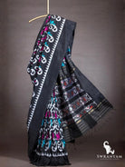 Black ikat silk saree with white temple border and flowing black pallu with multicolour ikat panels and gold zari stripes