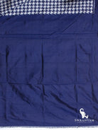Plain indigo blue silk blouse piece at the end of the houndstooth Pochampally ikat silk saree