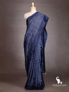 Front view of indigo blue ikat silk saree with white chevron ikat body and solid indigo border on mannequin