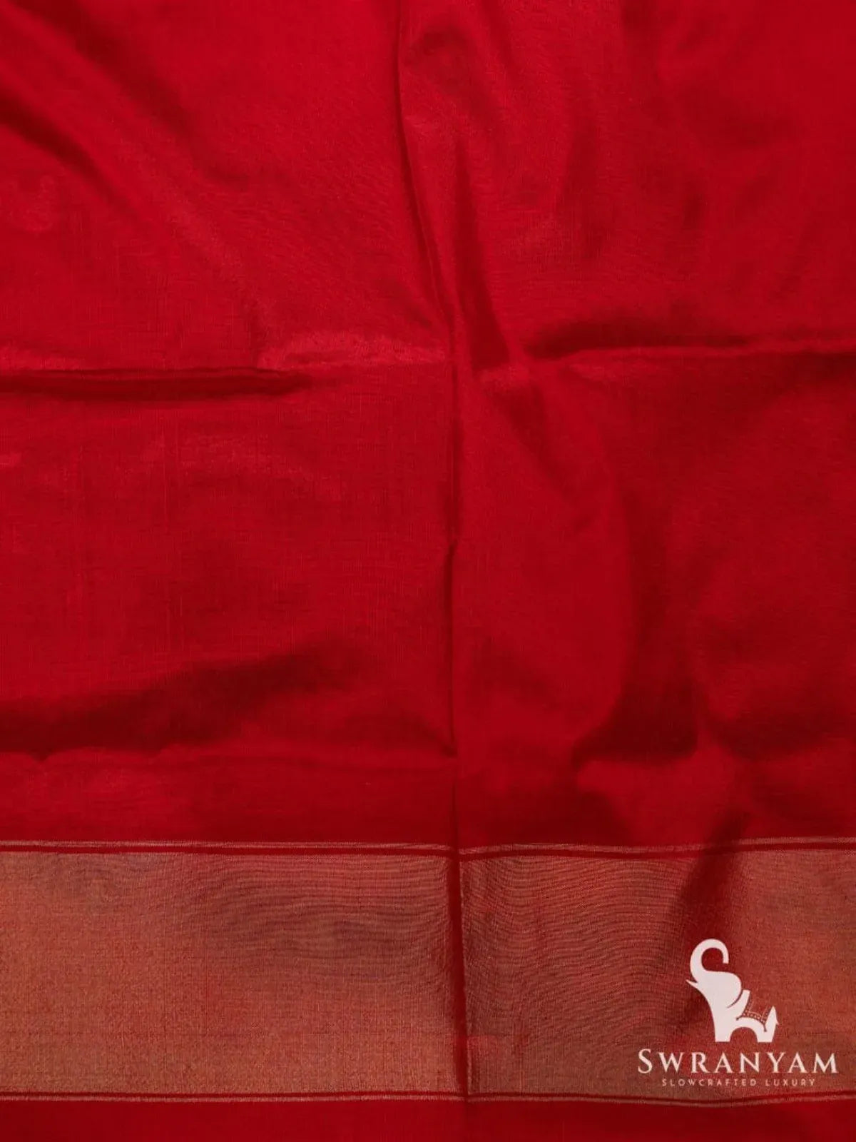 Red silk blouse piece with woven zari border matching the blue and red Pochampally ikat silk saree