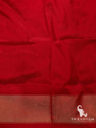 Red silk blouse piece with woven zari border matching the blue and red Pochampally ikat silk saree