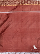 Pleats of cocoa brown Pochampally ikat silk saree with traditional white motifs and gold zari hem border