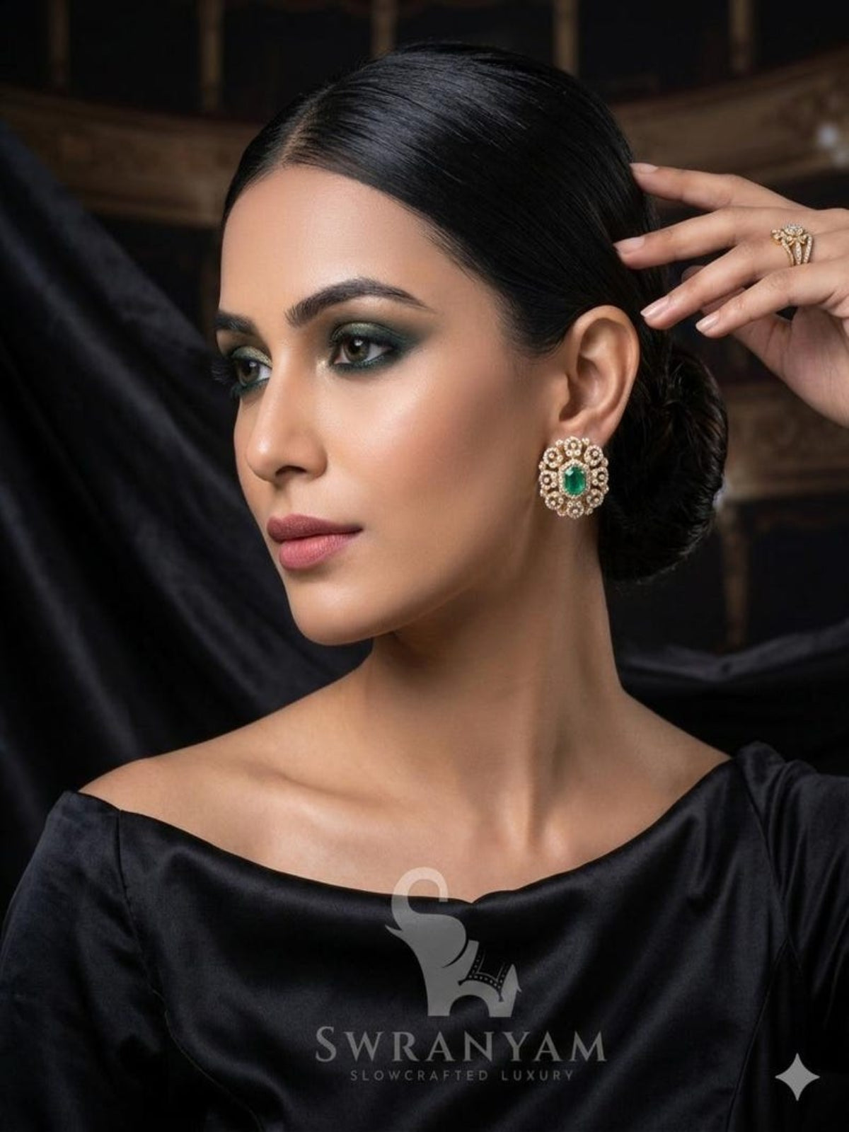 Model wearing Swranyam 925 silver Victorian emerald stud earrings