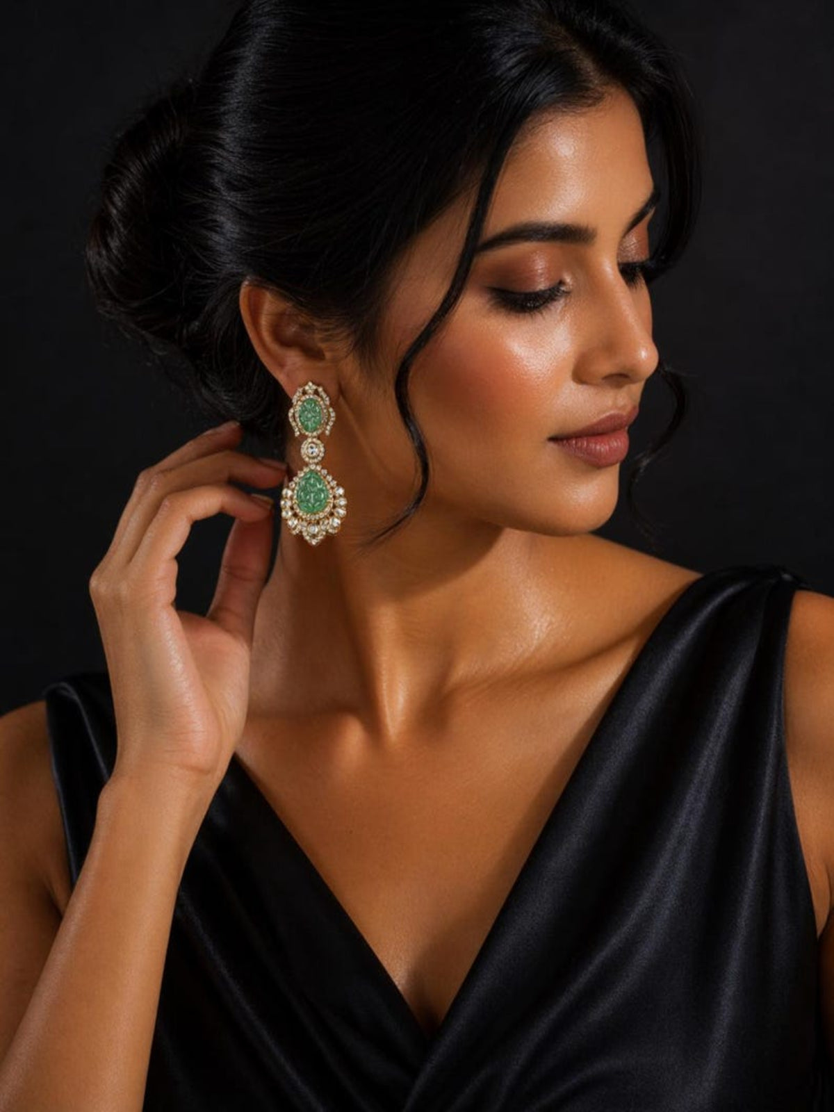 Model wearing Swranyam 925 silver Moissanite Polki carved emerald earrings