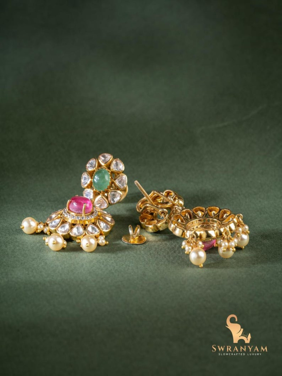 Swranyam silver Polki earrings pair on dark background showing gold-tone finish