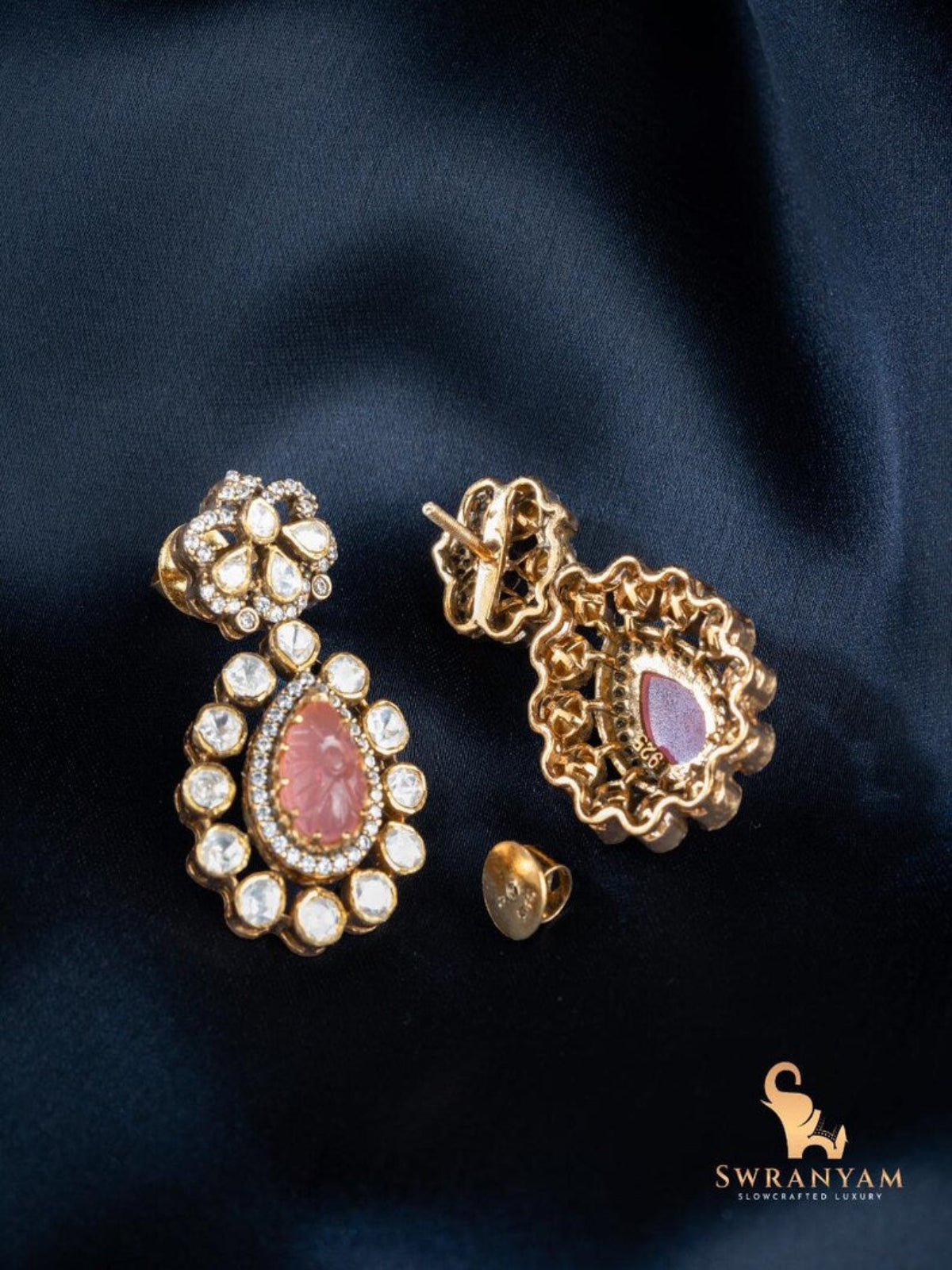 Close-up of Swranyam Moissanite Polki earrings with pink stone detail