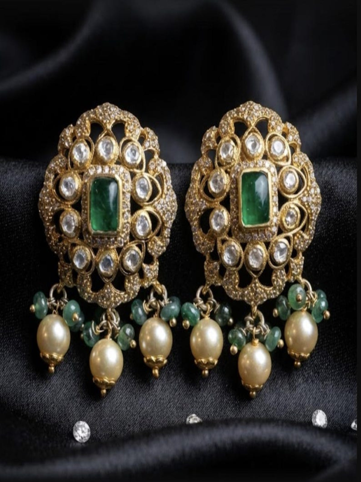 Swranyam silver Polki earrings pair showing emerald center and pearl detailing