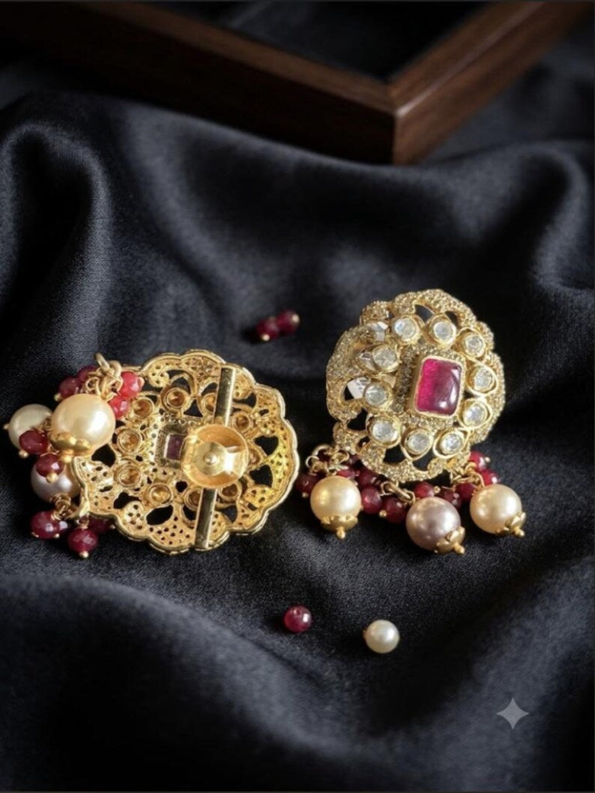 Swranyam silver Moissanite Polki earrings pair showing ruby stone and pearl beading