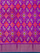 Purple ikat pallu with red, orange and white traditional motifs of orange twill ikat silk saree